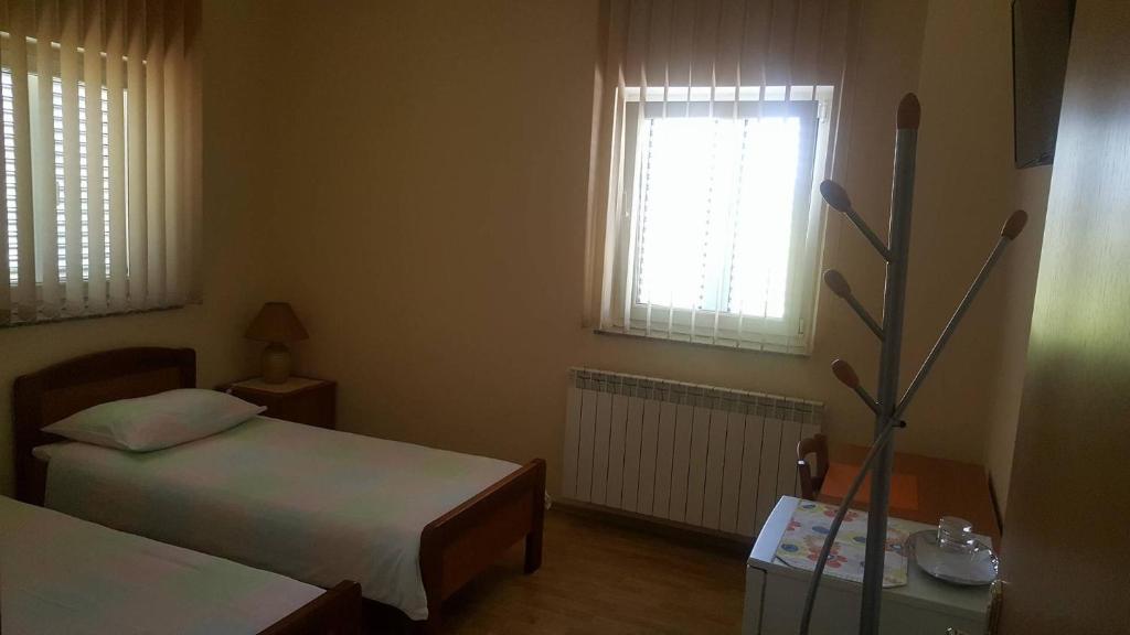 Postel nebo postele na pokoji v ubytování Apartments Barbara