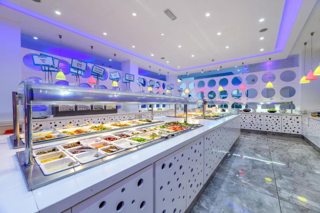 a buffet line with many different types of food at River Rock Hotel in Ayia Napa