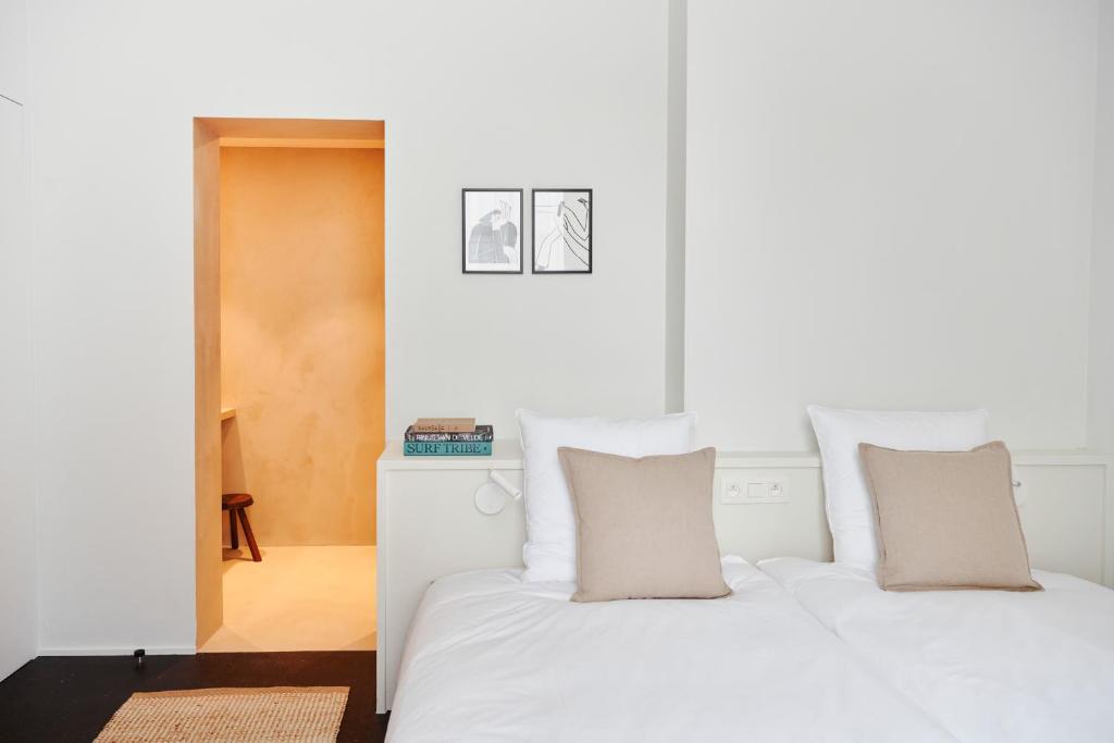 Postel nebo postele na pokoji v ubytování Edgar Guesthouse