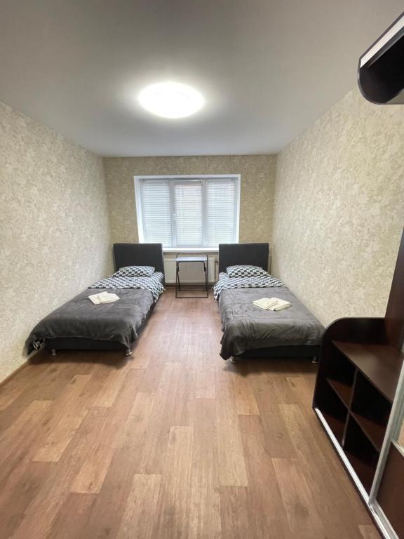 Postel nebo postele na pokoji v ubytování Апартаменты Проспект Победы 101
