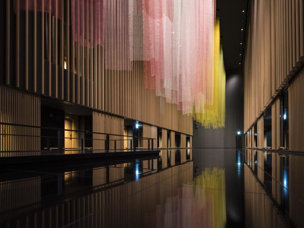 a hallway of a building with lights on it at Portom International Hokkaido in Chitose