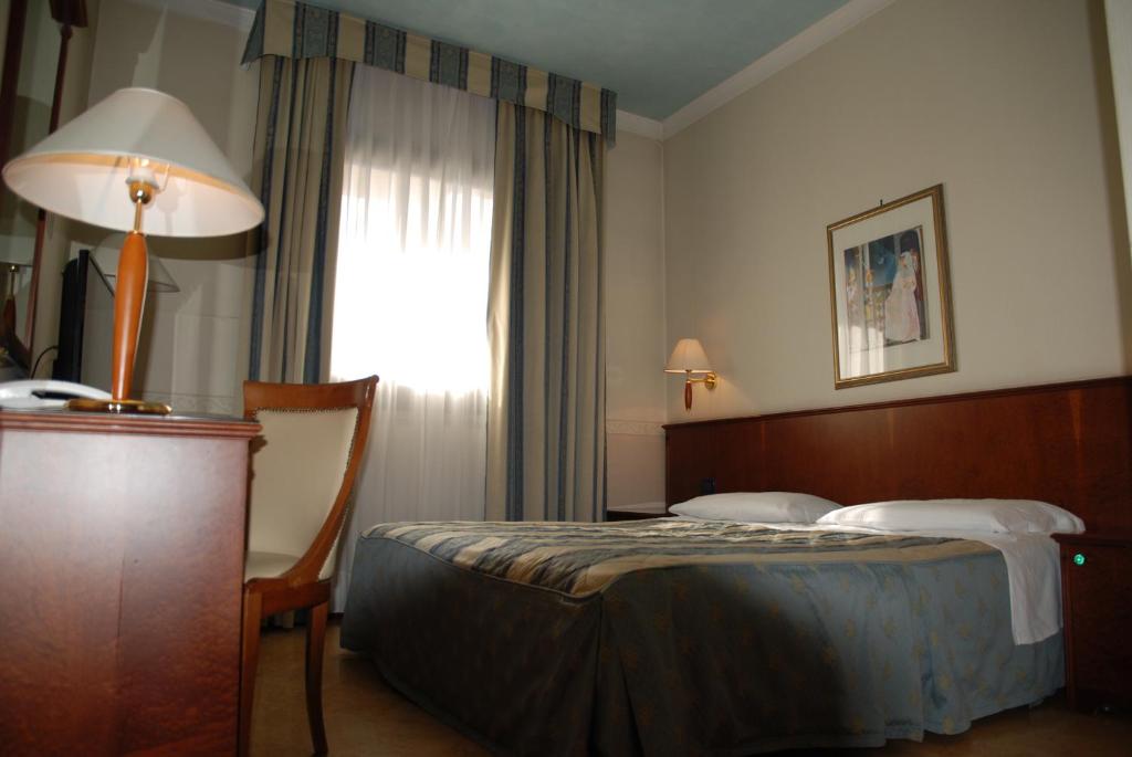 Posteľ alebo postele v izbe v ubytovaní Hotel Lugano Torretta