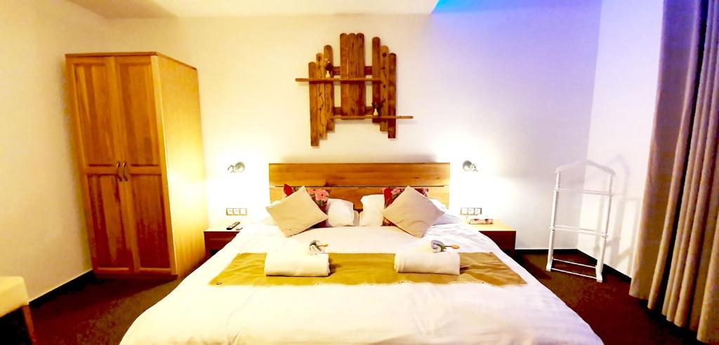 Postel nebo postele na pokoji v ubytování Hotel Farma Vysoká
