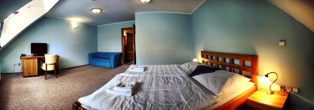Postel nebo postele na pokoji v ubytování Hotel Farma Vysoká