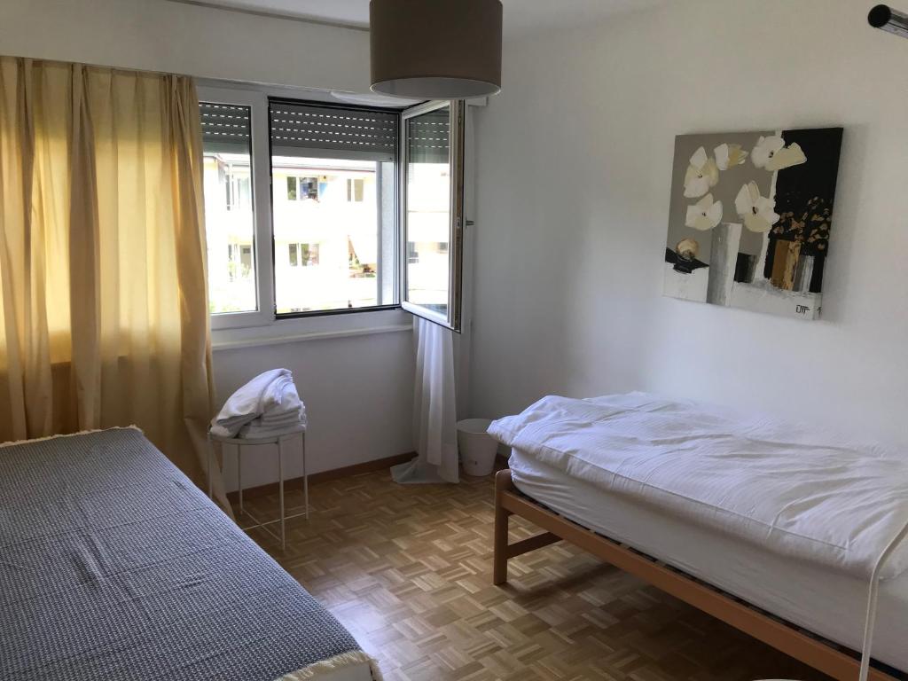 Postel nebo postele na pokoji v ubytování Bijou Appartment