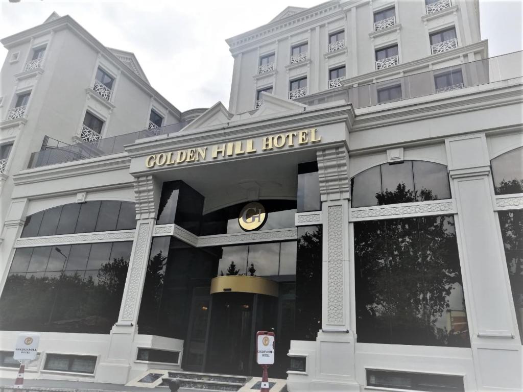 a building with a clock on the front of it at GOLDEN HİLL HOTEL DOWNTOWN in Istanbul