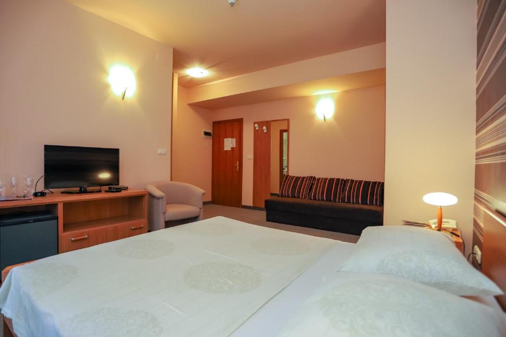 Voodi või voodid majutusasutuse Hotel Neva toas