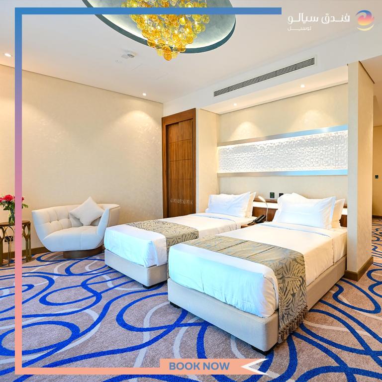 Katil atau katil-katil dalam bilik di Cielo Hotel Lusail Qatar