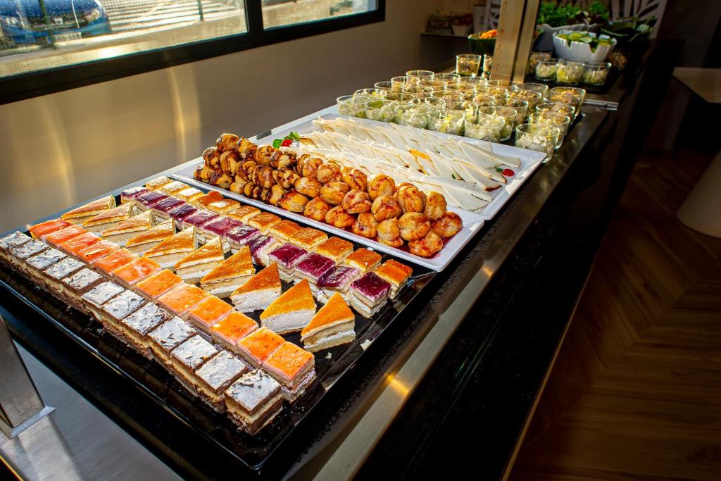 a buffet line with many different types of food at Hotel Taimar in Costa Calma