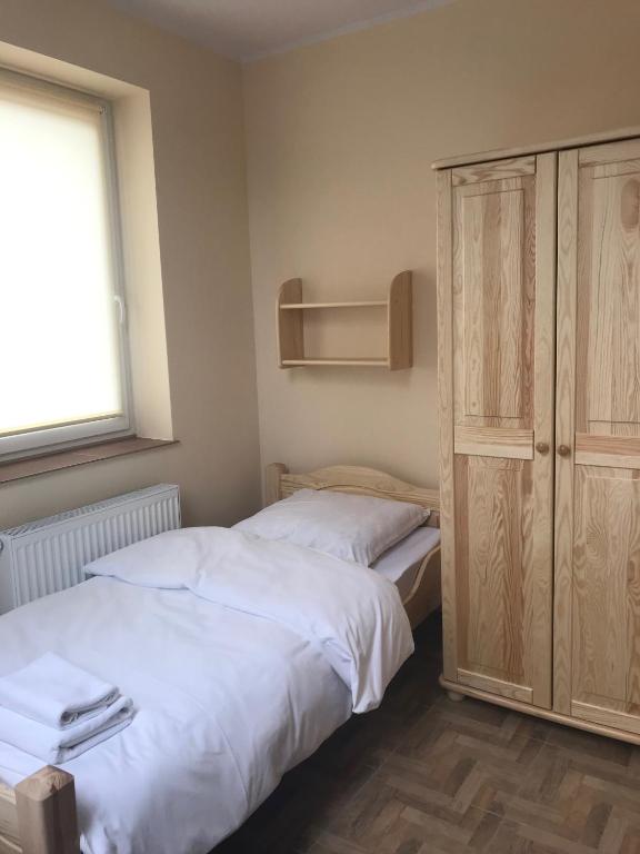Postel nebo postele na pokoji v ubytování Siedem Drzew