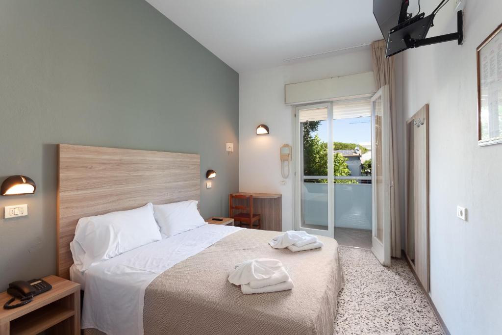 Postel nebo postele na pokoji v ubytování Hotel Admiral