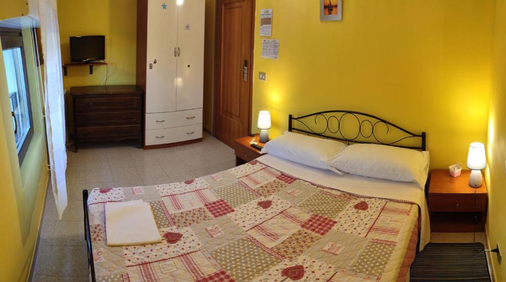 Postel nebo postele na pokoji v ubytování Complesso turistico Aurora - camere B&B
