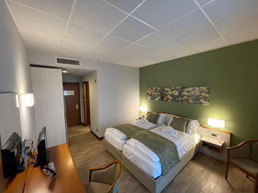 Łóżko lub łóżka w pokoju w obiekcie Hotel all'Orso
