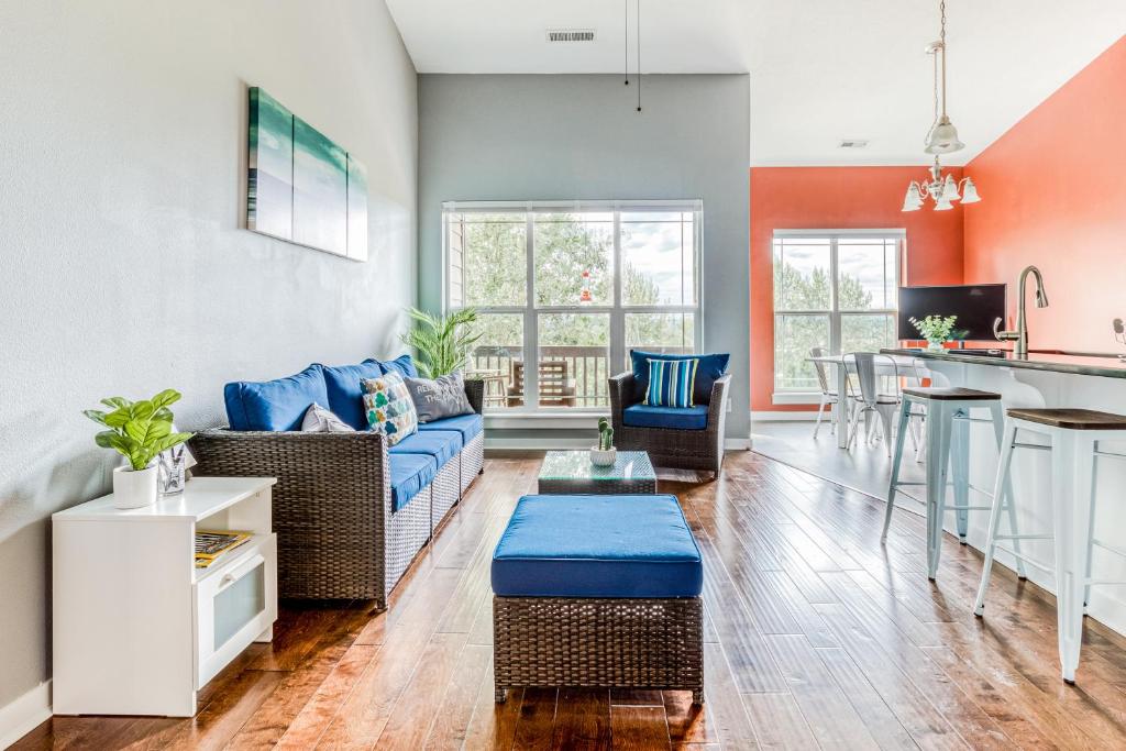 a living room with a couch and a table at Happy Valley Hideway in Happy Valley