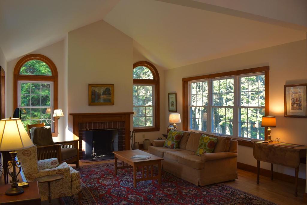 a living room with a couch and a fireplace at Vannah Lane in Port Clyde