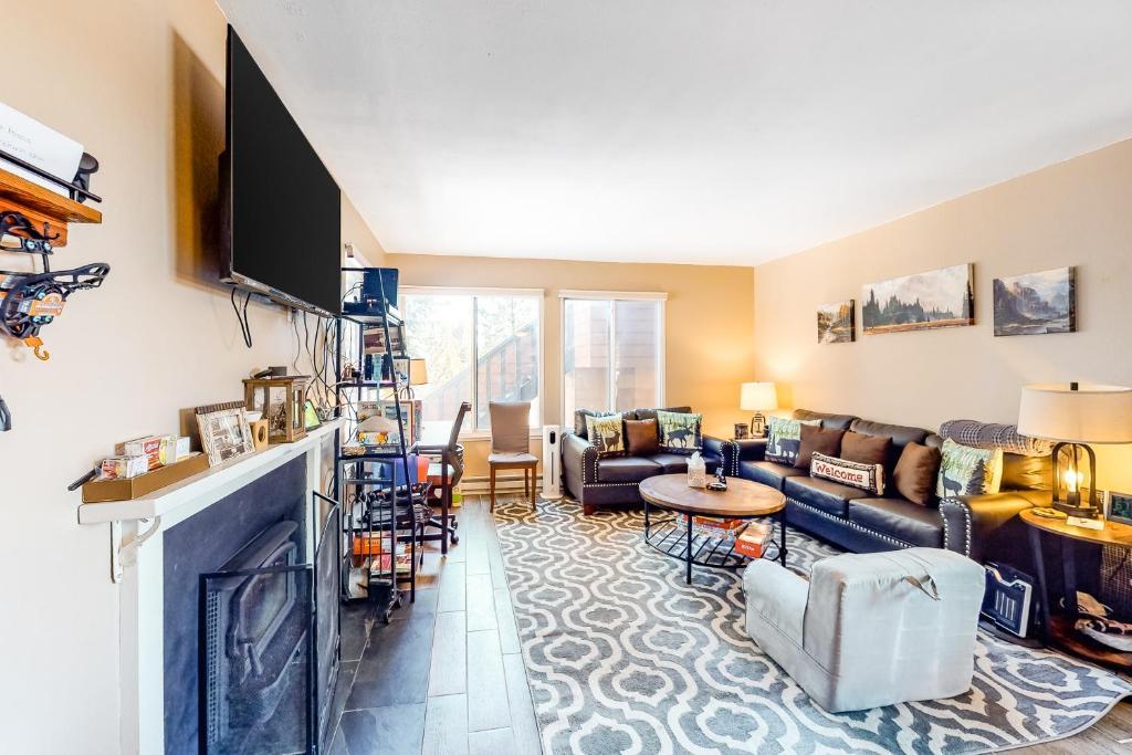 a living room with a couch and a fireplace at 11529 Snowpeak Way #619 in Truckee