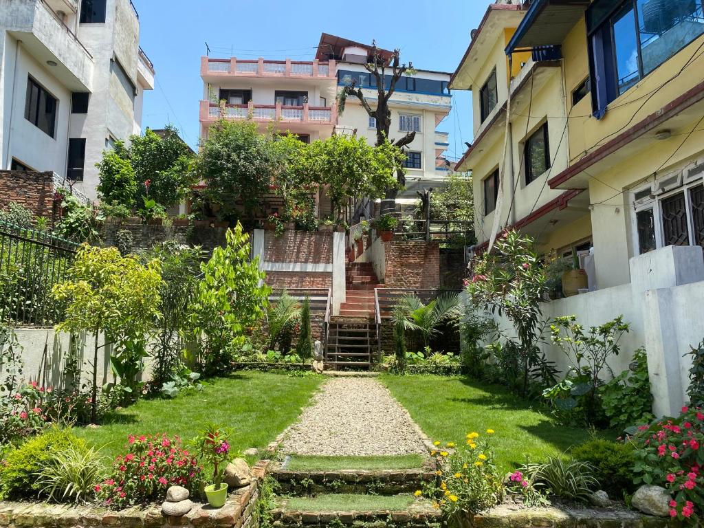 a garden in the middle of a building at Birds Nest Hostel in Kathmandu