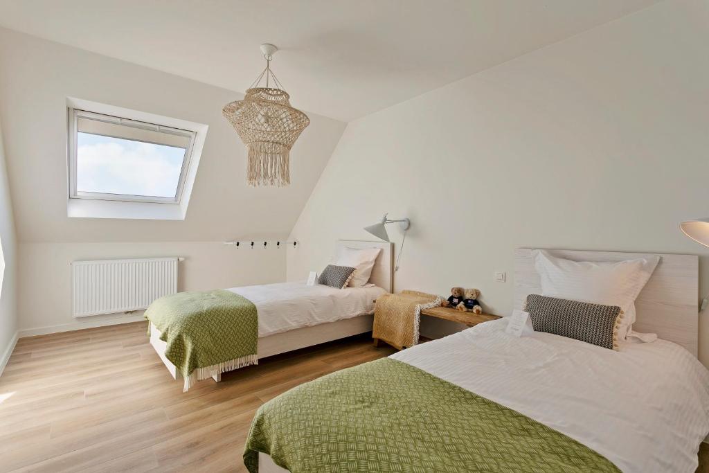 Postel nebo postele na pokoji v ubytování Villa Boho
