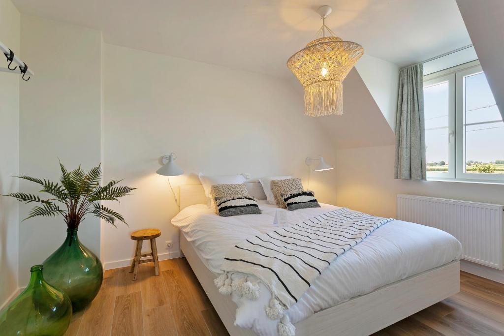 Postel nebo postele na pokoji v ubytování Villa Boho