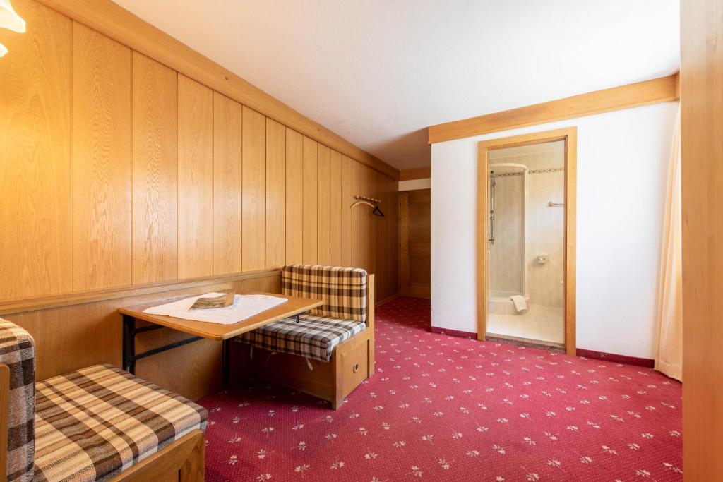 Postel nebo postele na pokoji v ubytování Hotel Stilfserhof