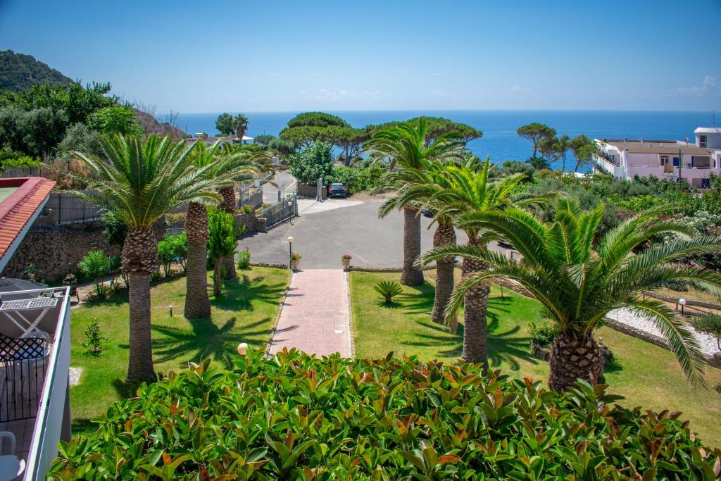 a view from the balcony of a resort with palm trees at Hotel Villa Rita in Ischia