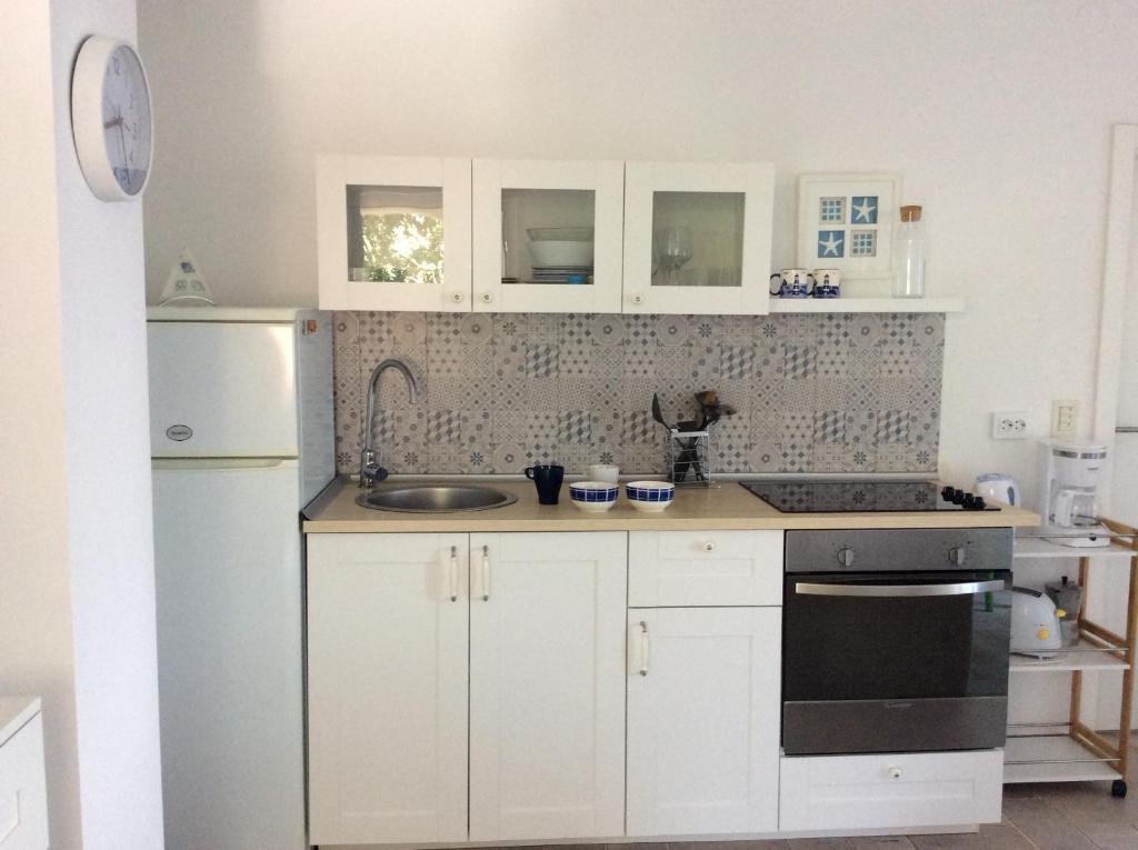 Kuchyň nebo kuchyňský kout v ubytování Apartment Tin