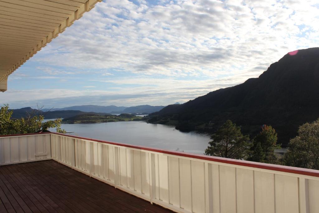 a view of a river from the balcony of a house at Landlig hus på kysten in Tustna