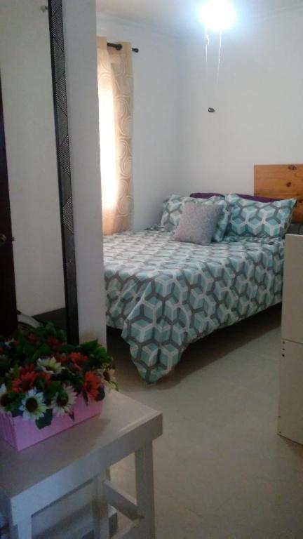 Postel nebo postele na pokoji v ubytování M & L Shared Apartment