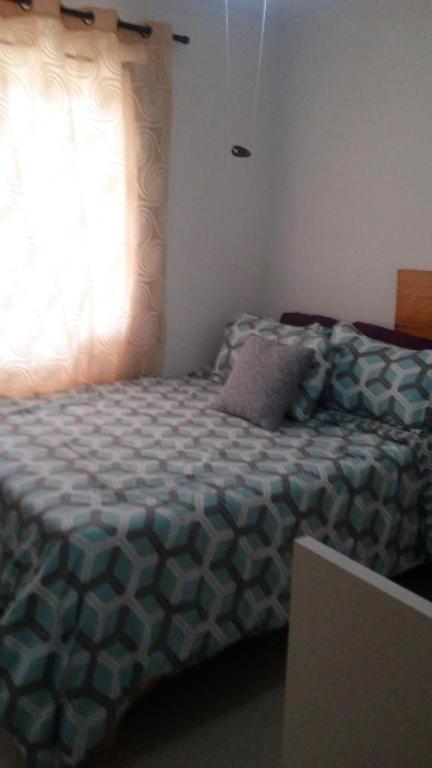 Postel nebo postele na pokoji v ubytování M & L Shared Apartment