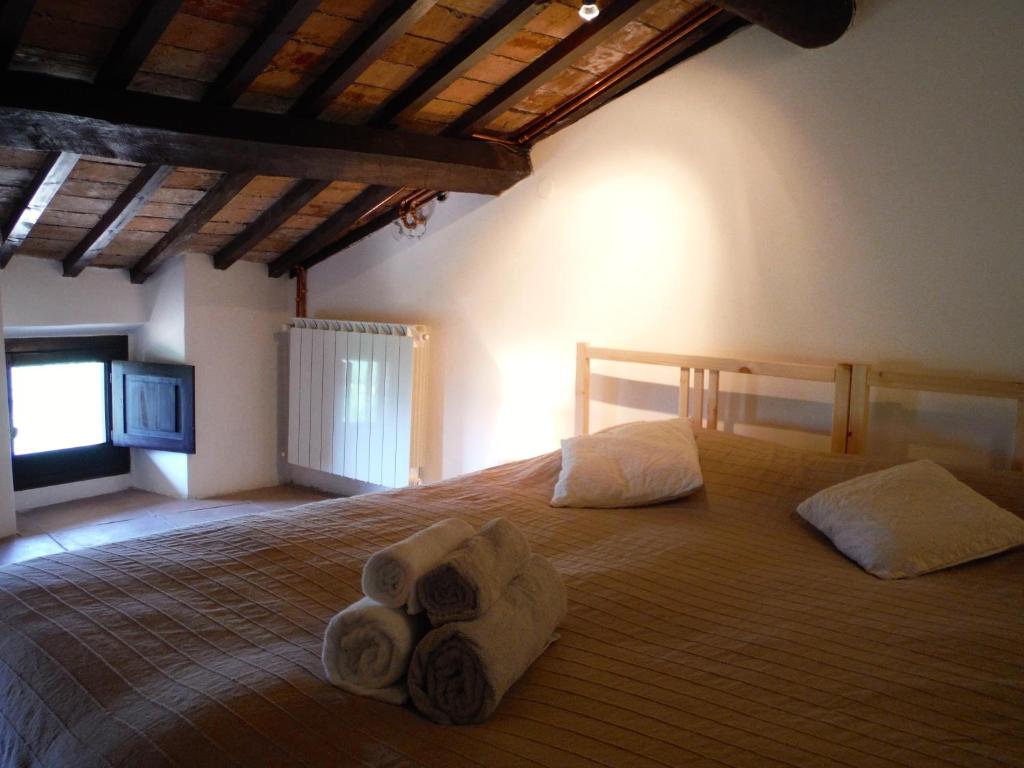 Postel nebo postele na pokoji v ubytování Casa Due Archi Labro