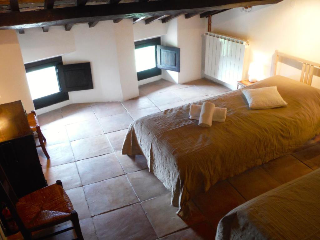 Postel nebo postele na pokoji v ubytování Casa Due Archi Labro