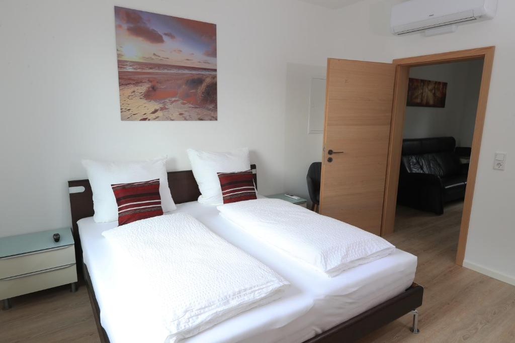 Postel nebo postele na pokoji v ubytování Modern Home Check-in & chill down auf 65 qm²