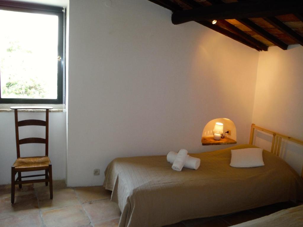 Postel nebo postele na pokoji v ubytování Casa Due Archi Labro