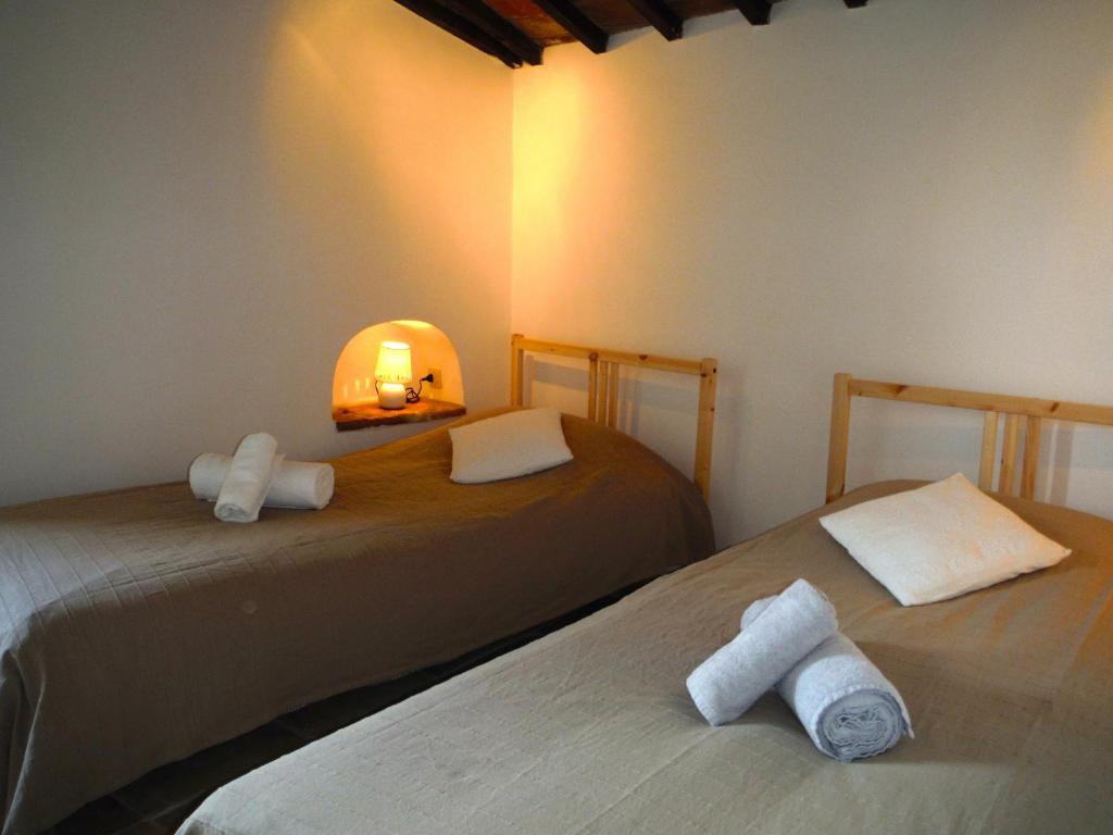 Postel nebo postele na pokoji v ubytování Casa Due Archi Labro