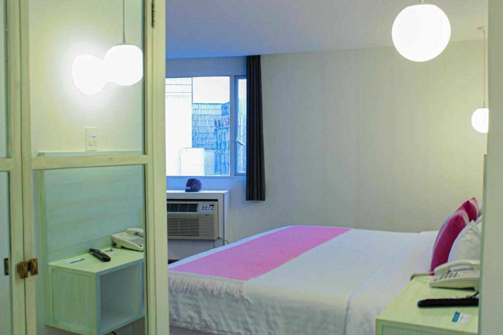Кровать или кровати в номере Hotel Fontan Reforma Centro Historico