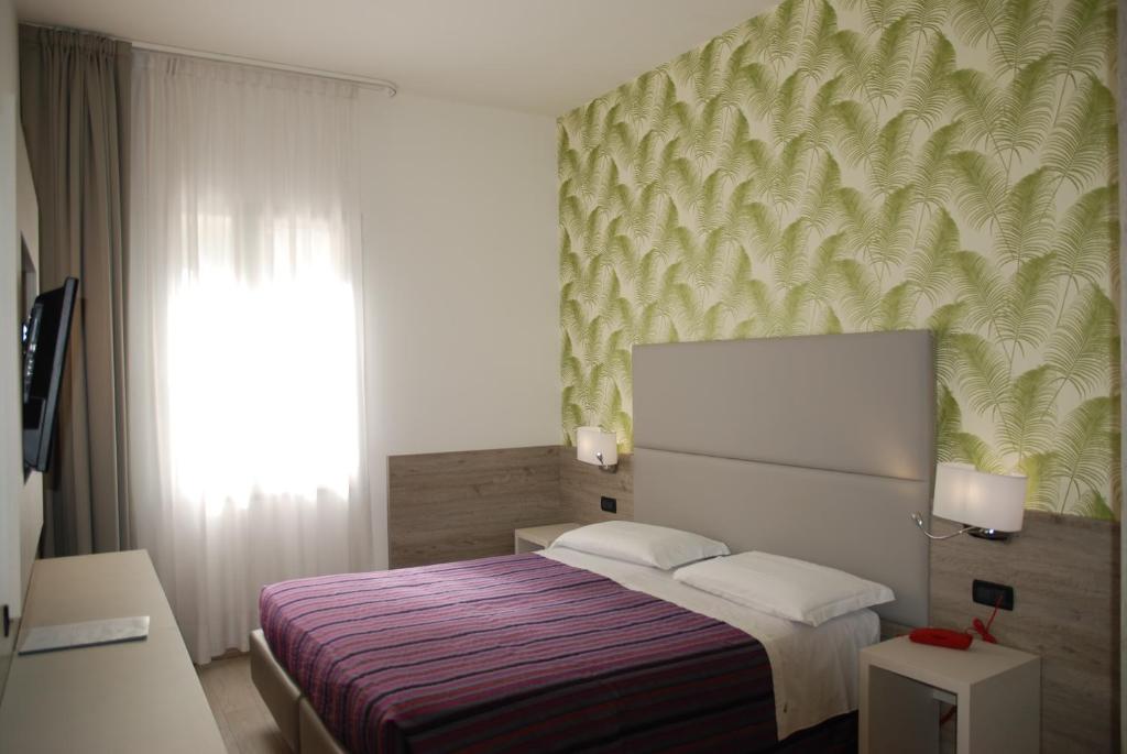 Posteľ alebo postele v izbe v ubytovaní Hotel Lugano Torretta