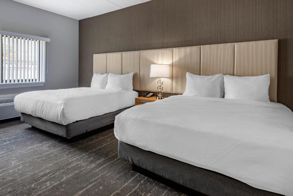 Postel nebo postele na pokoji v ubytování Somerset Lofts