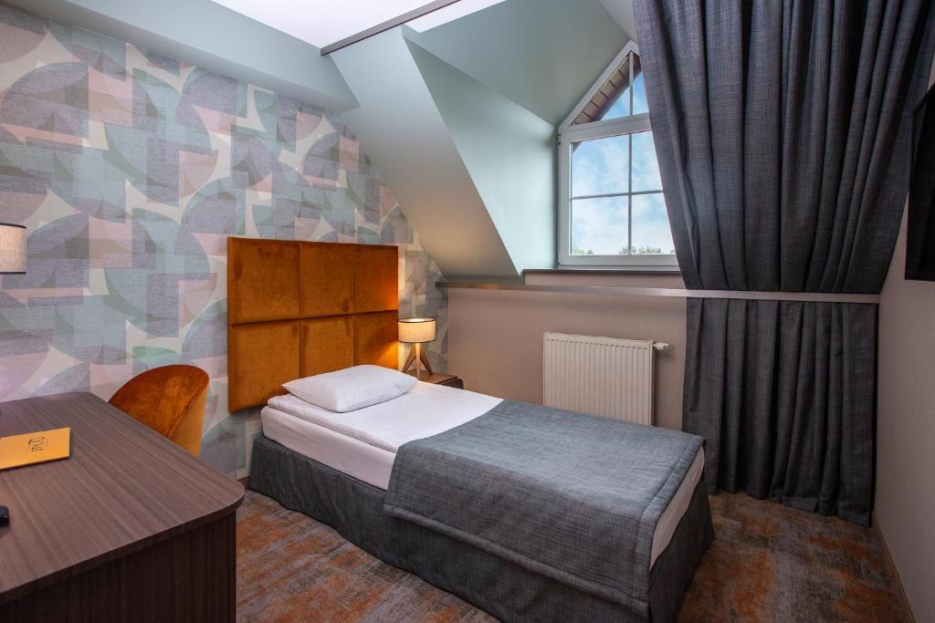 Postel nebo postele na pokoji v ubytování Hotel Styl 70