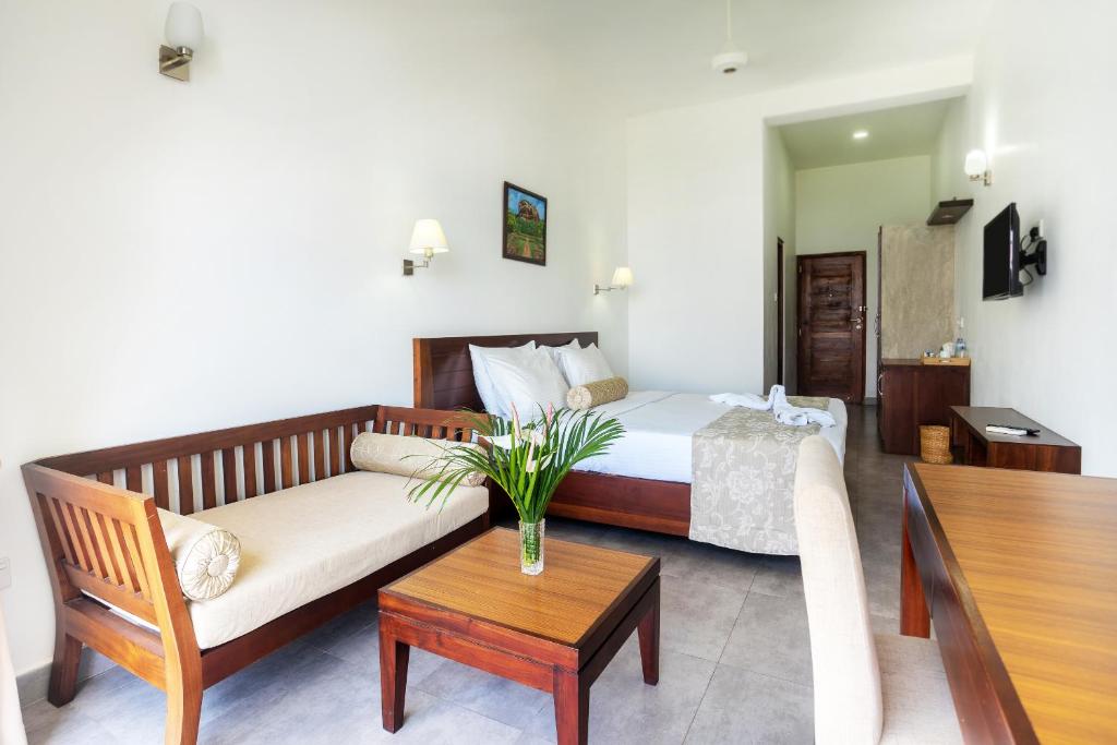 Postel nebo postele na pokoji v ubytování The Kandyan Villa