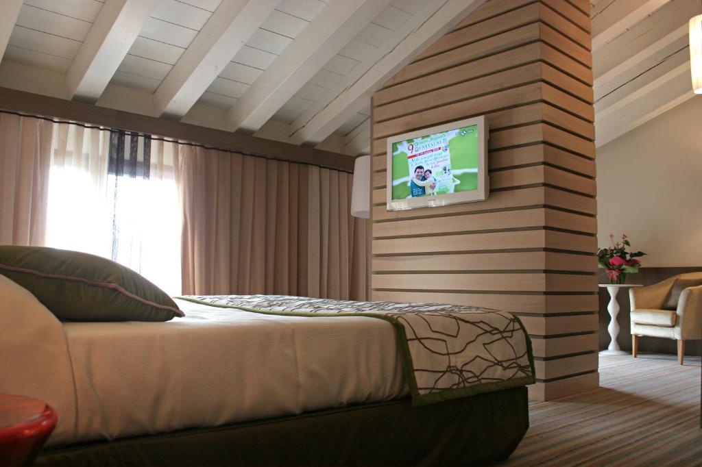 Postel nebo postele na pokoji v ubytování Hotel Filanda