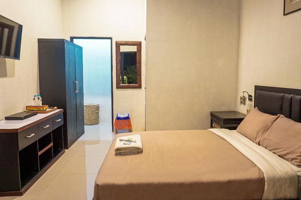 Voodi või voodid majutusasutuse The Wisma Pulau Merah toas