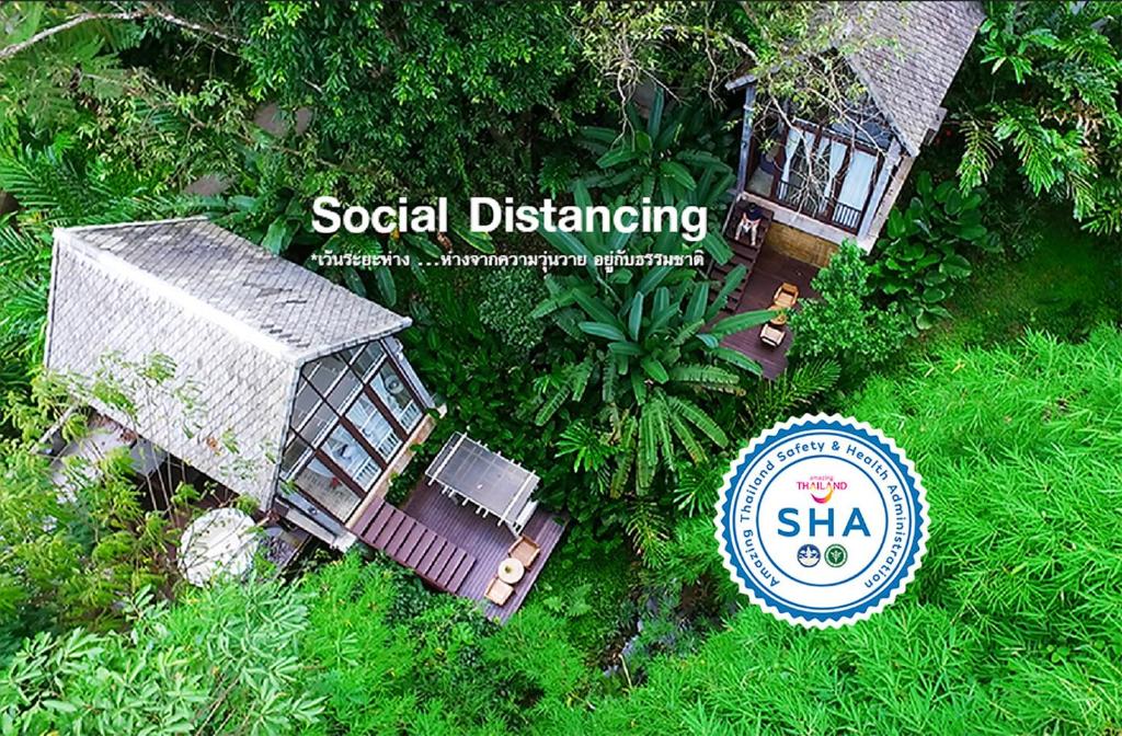 an overhead view of a small house in the grass at Proud Phu Fah Hip & Green Resort in Mae Rim