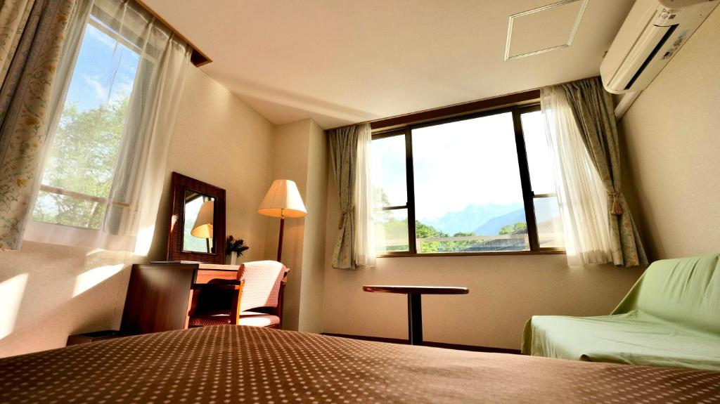 Postel nebo postele na pokoji v ubytování Hotel Oak Forest