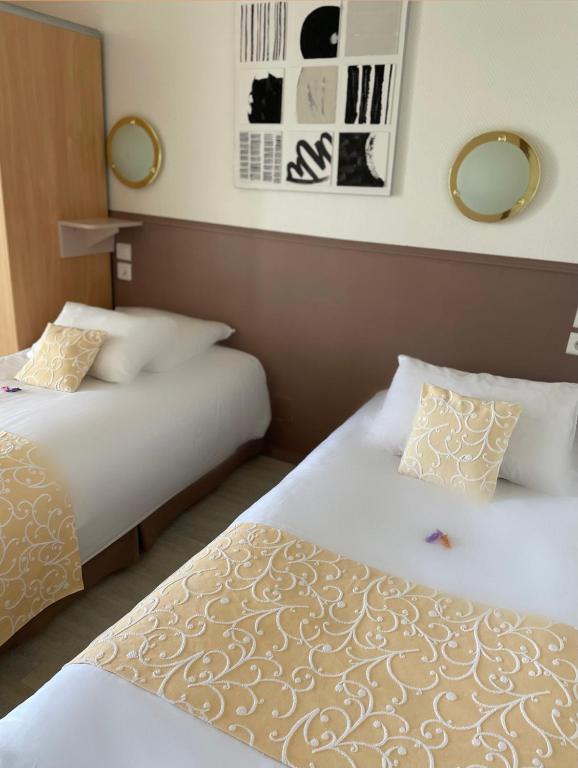 Postel nebo postele na pokoji v ubytování Hôtel Côté Sud Léman
