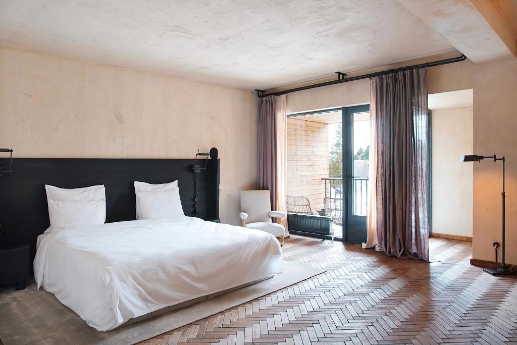 Кровать или кровати в номере Rooms Hotel Kokhta