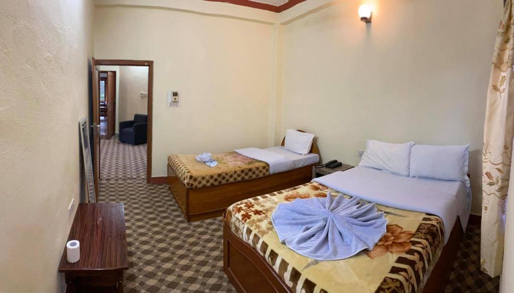 Postel nebo postele na pokoji v ubytování Hotel Blue Magnet