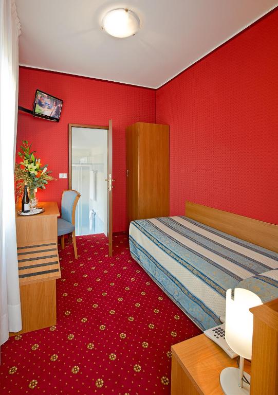 Postel nebo postele na pokoji v ubytování Hotel Nazionale