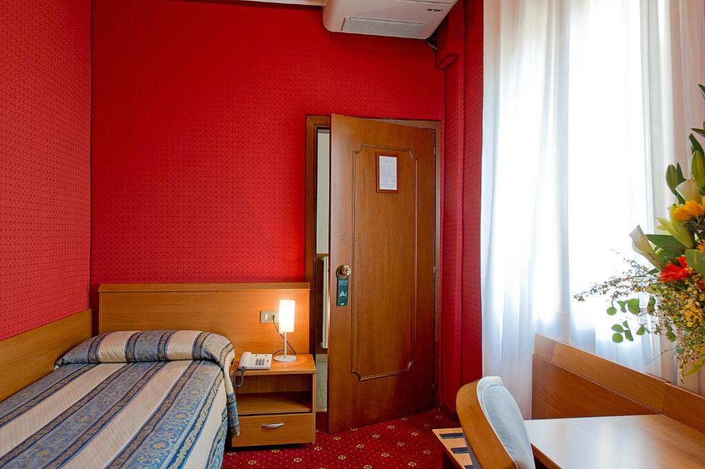Postel nebo postele na pokoji v ubytování Hotel Nazionale