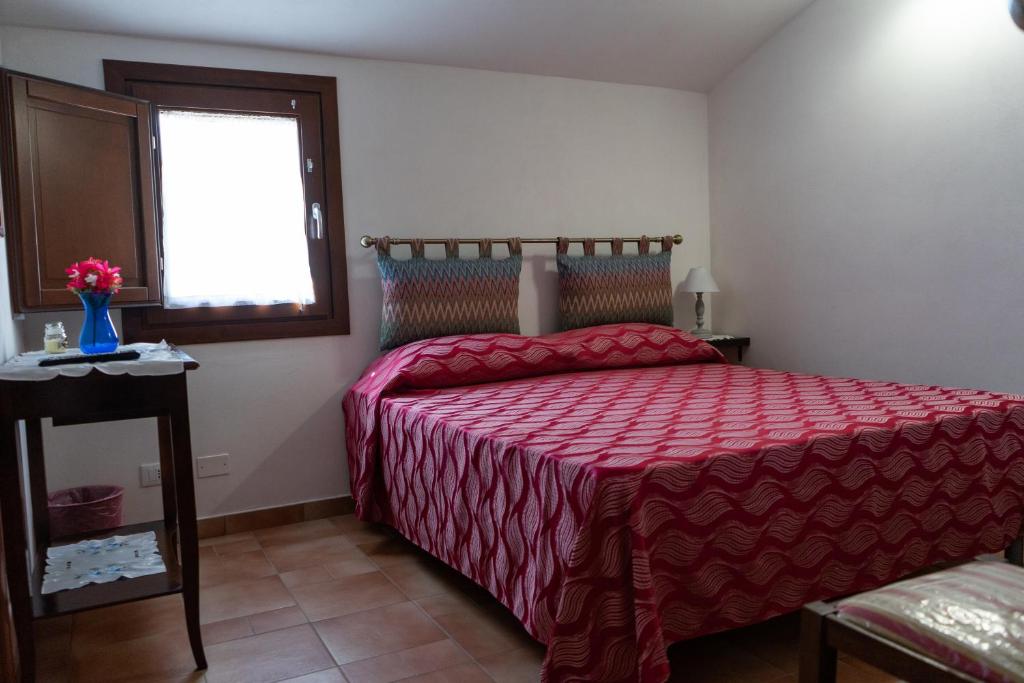 A bed or beds in a room at B&B 4 Stagioni
