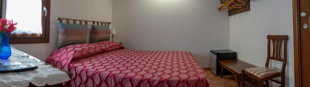 A bed or beds in a room at B&B 4 Stagioni